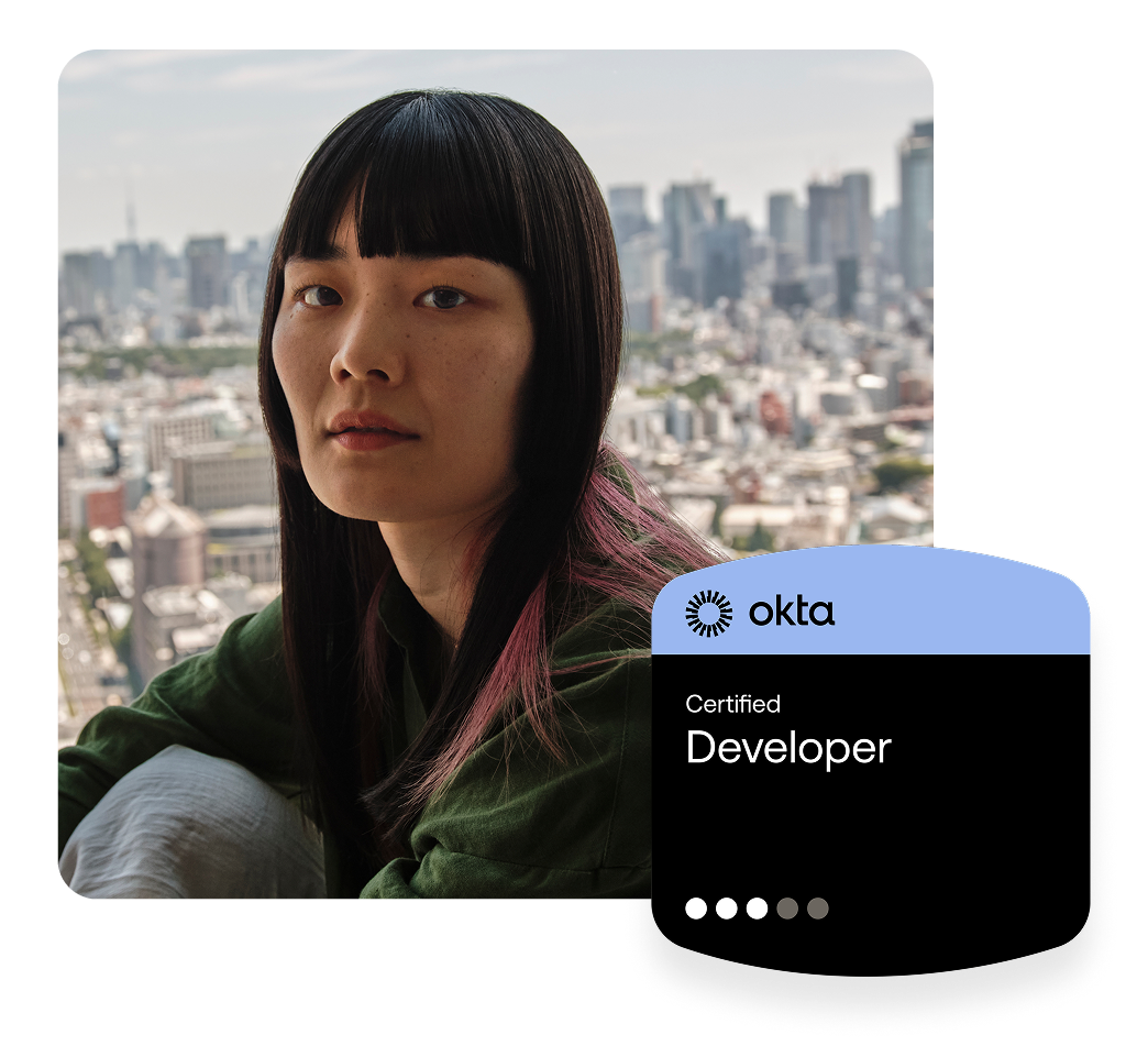 Woman with dark hair and pink highlights with a city skyline in the background, next to an Okta Certified Developer badge.