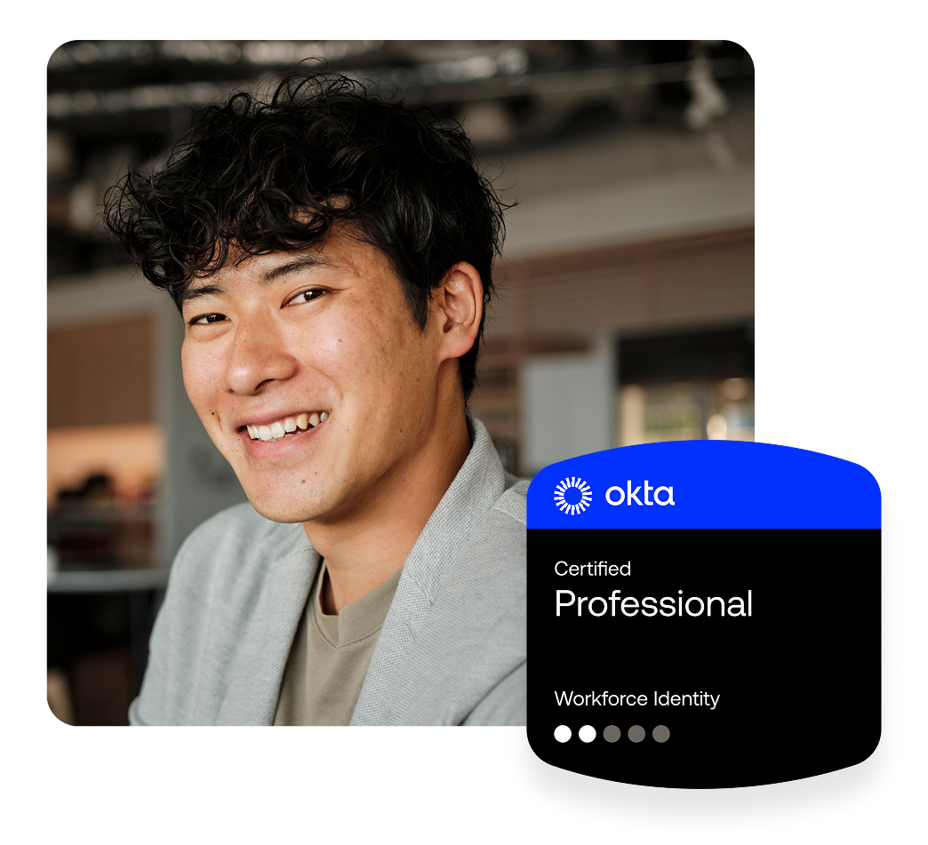 A smiling man with short dark curly hair in a grey blazer, next to an Okta Certified Professional badge.